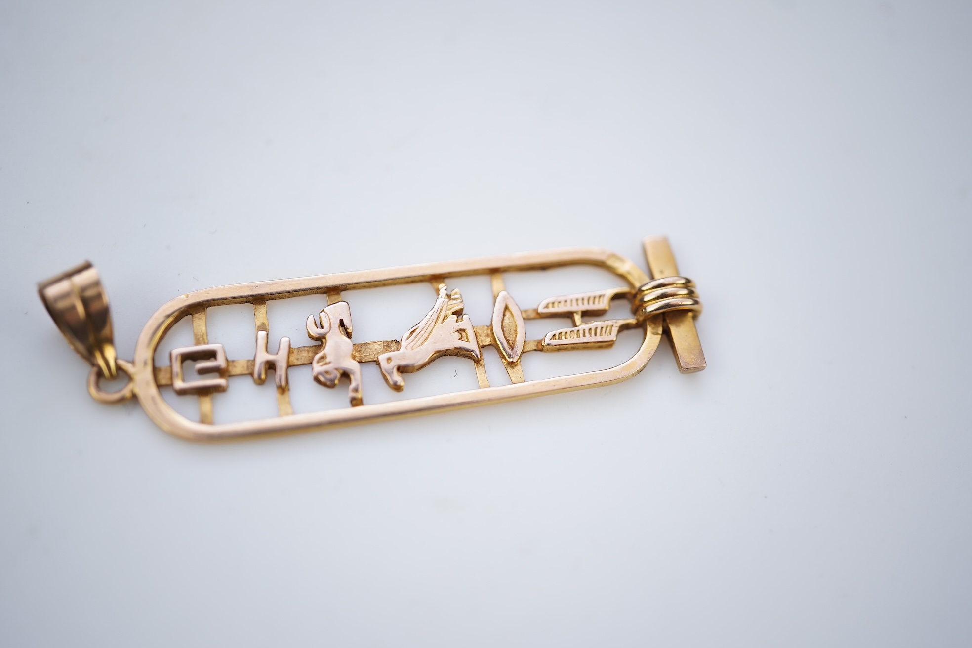 Two gold pendants